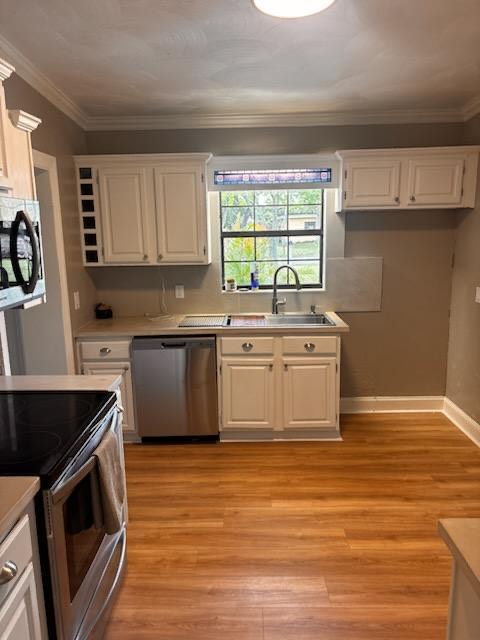 Kitchen with dishwasher and window over the sink